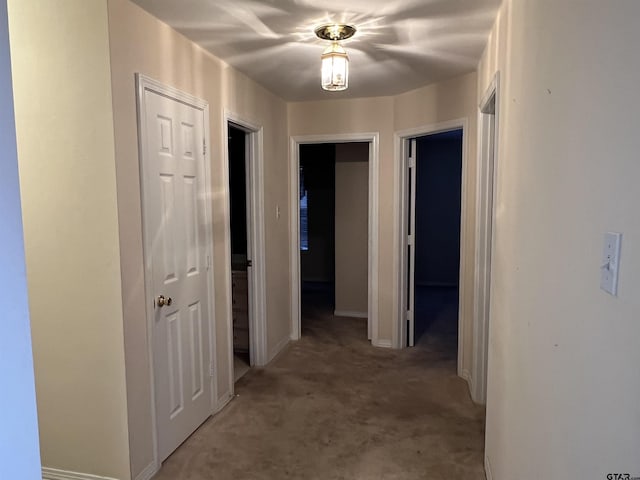 hallway featuring light carpet