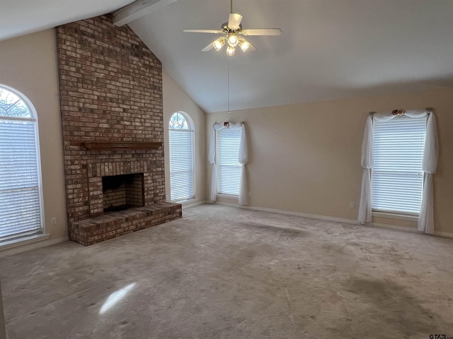 unfurnished living room featuring ceiling fan, carpet, vaulted ceiling with beams, and a fireplace