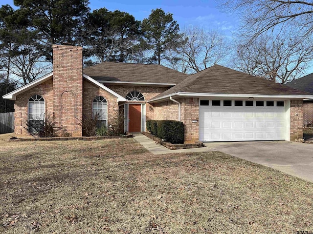 ranch-style house featuring a front lawn and a garage