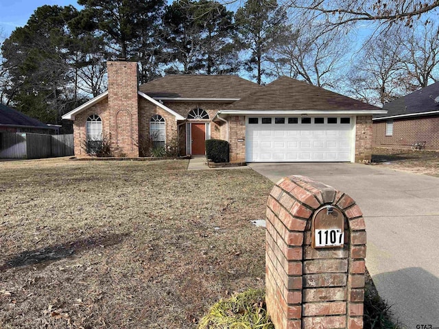 ranch-style house featuring a front lawn and a garage