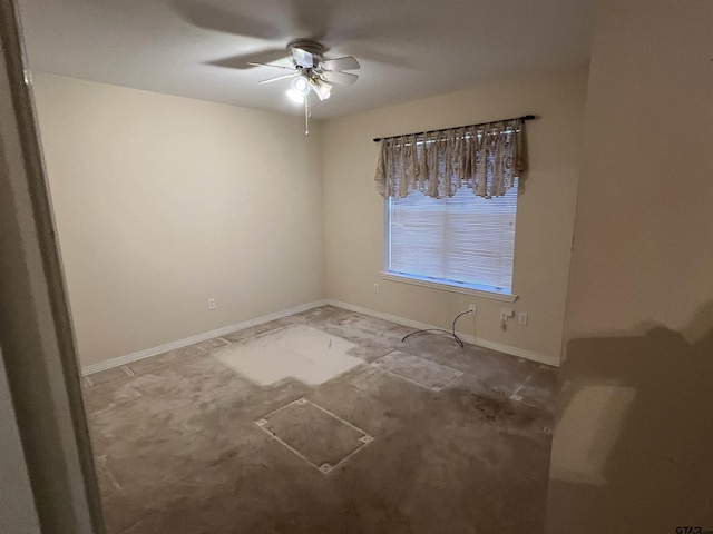 spare room with ceiling fan