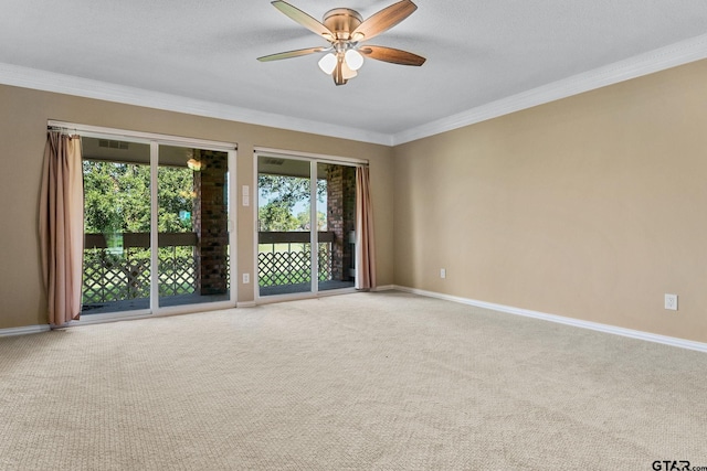 unfurnished room with ceiling fan, a textured ceiling, ornamental molding, and carpet floors