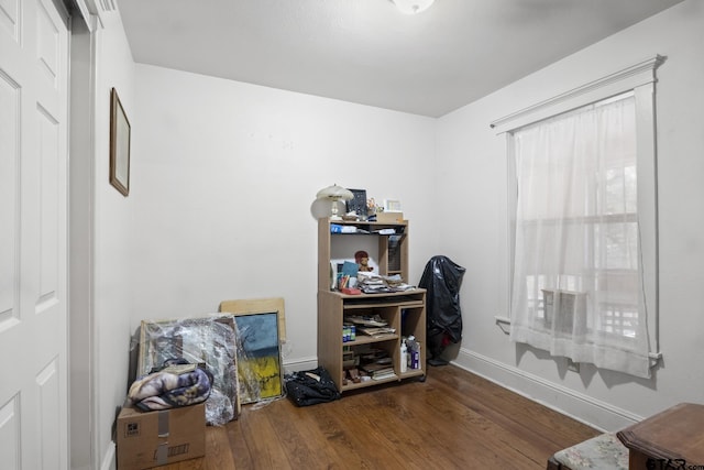 office with dark wood-type flooring