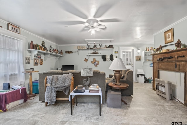 living room featuring heating unit, crown molding, and ceiling fan