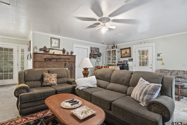 living room featuring a wealth of natural light, ornamental molding, and ceiling fan