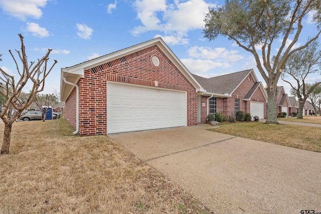 view of front of home with a garage and a front yard