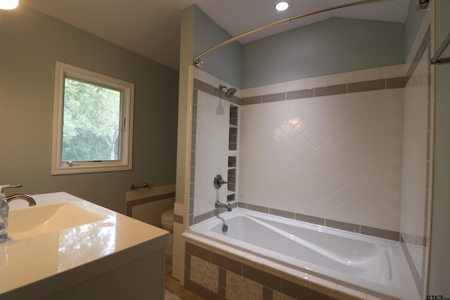 full bathroom with vanity, toilet, and tiled shower / bath combo