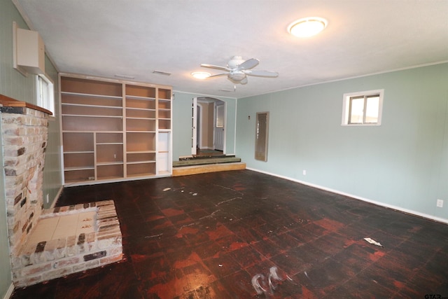 unfurnished living room featuring ceiling fan