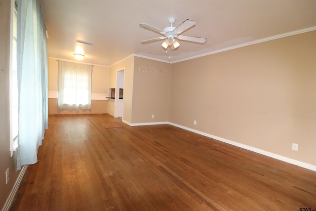 spare room with hardwood / wood-style flooring, ceiling fan, and ornamental molding