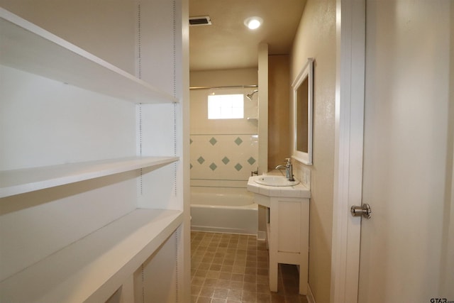 bathroom with vanity and bathtub / shower combination