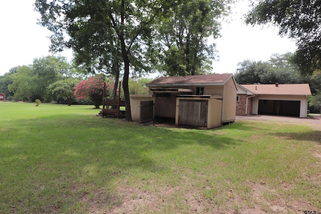 view of yard featuring a garage