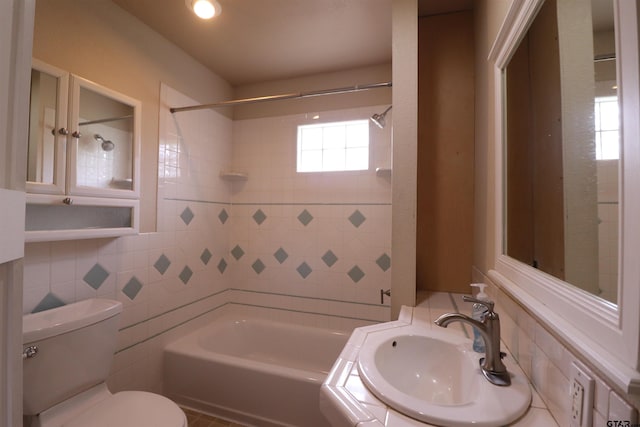 full bathroom with bathing tub / shower combination, sink, backsplash, and toilet