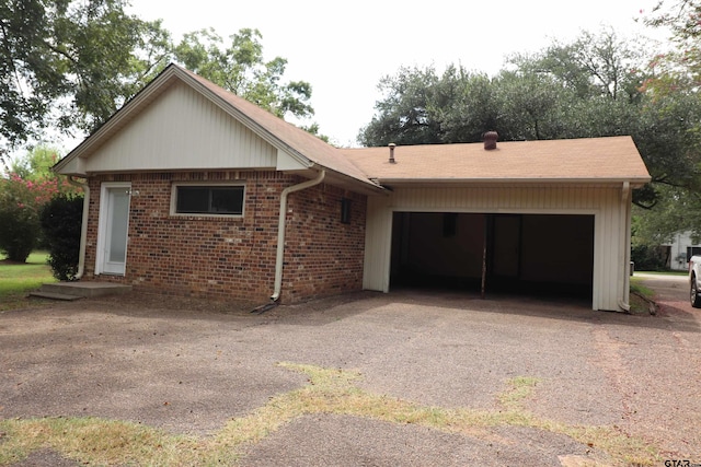 ranch-style home featuring a garage