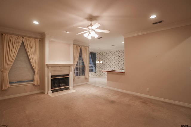 704 Paloma St, Tyler, TX 75703 - unfurnished living room with ceiling fan, crown molding, a fireplace with flush hearth, light carpet, and recessed lighting