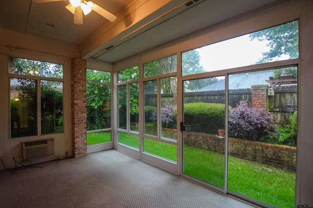 704 Paloma St, Tyler, TX 75703 - unfurnished sunroom with a wall mounted AC, a ceiling fan, and carpet flooring