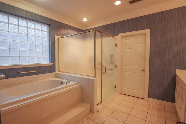 704 Paloma St, Tyler, TX 75703 - bathroom featuring a garden tub, a stall shower, tile patterned flooring, wallpapered walls, and vanity