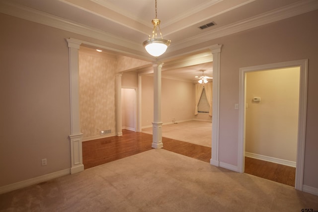704 Paloma St, Tyler, TX 75703 - unfurnished room featuring ornate columns, carpet, ornamental molding, a ceiling fan, and a tray ceiling