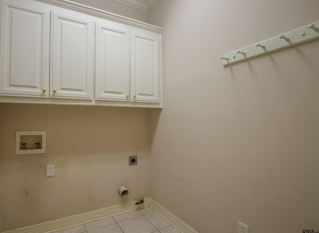 704 Paloma St, Tyler, TX 75703 - laundry area featuring tile patterned floors, electric dryer hookup, cabinet space, washer hookup, and crown molding