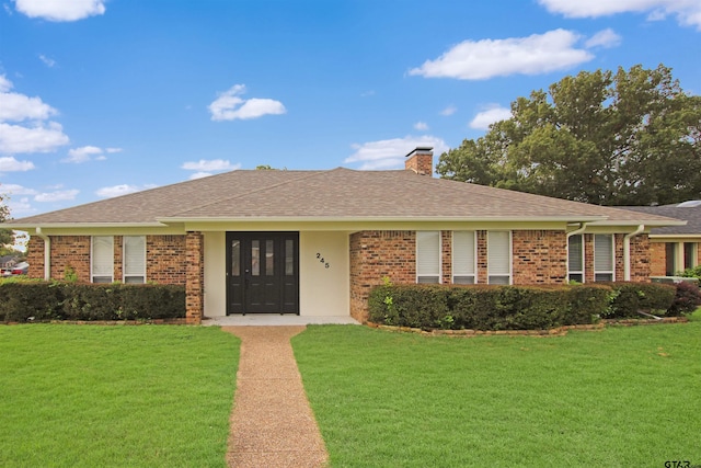 single story home with a front yard and french doors