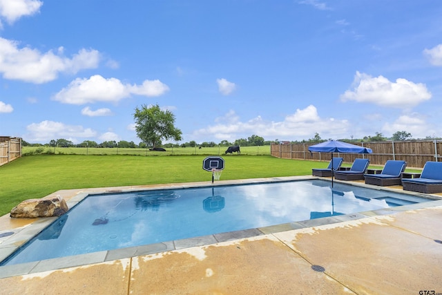 view of pool featuring a lawn