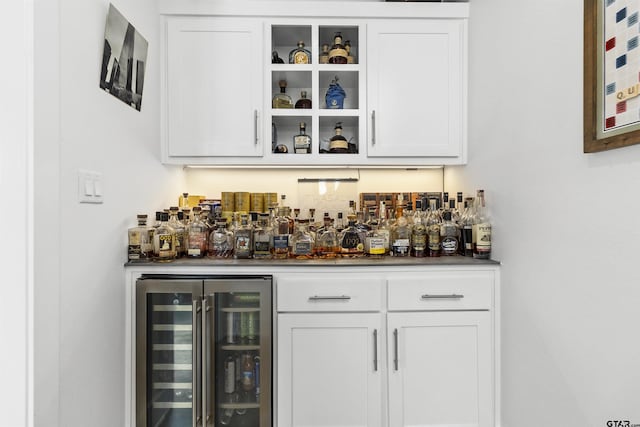 bar featuring white cabinetry and wine cooler