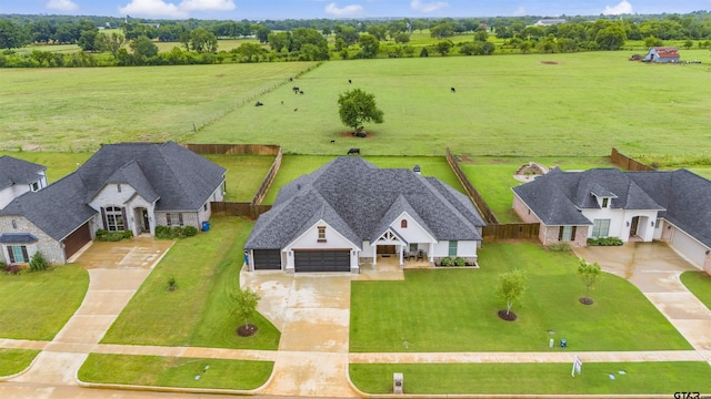 birds eye view of property featuring a rural view