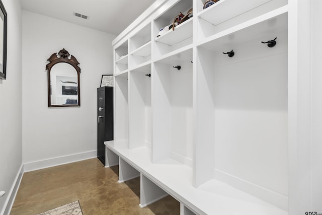 mudroom with concrete flooring