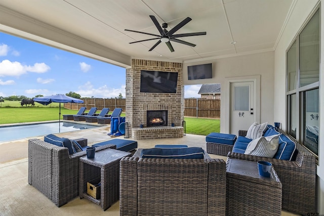 view of patio featuring ceiling fan and an outdoor brick fireplace