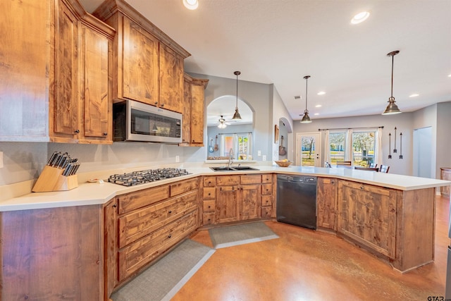 kitchen featuring kitchen peninsula, stainless steel appliances, ceiling fan, sink, and hanging light fixtures