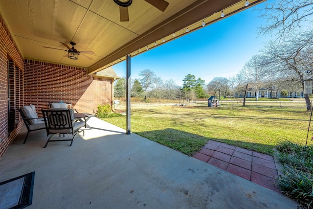 view of patio featuring ceiling fan