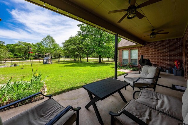view of patio featuring ceiling fan