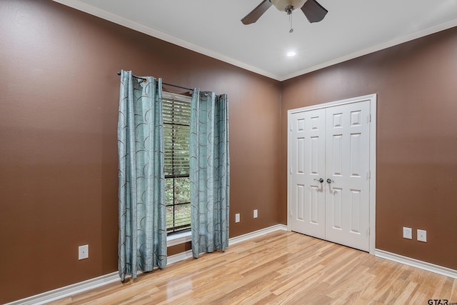 interior space featuring crown molding, ceiling fan, and light hardwood / wood-style flooring