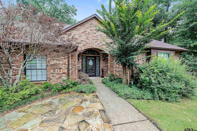 view of front of house featuring brick siding