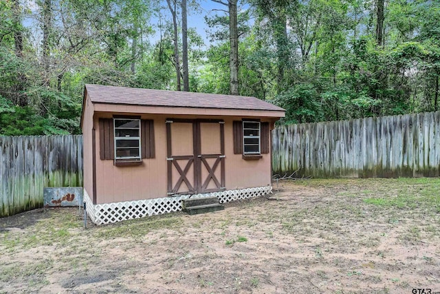 view of shed featuring a fenced backyard