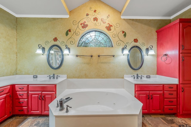 bathroom with vaulted ceiling, a tub with jets, vanity, and ornamental molding