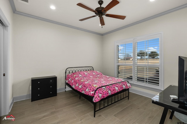 bedroom featuring crown molding, ceiling fan, and hardwood / wood-style flooring