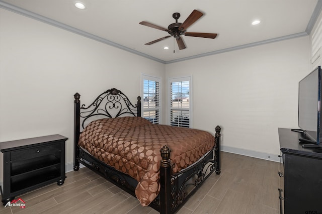 bedroom with hardwood / wood-style floors, crown molding, and ceiling fan