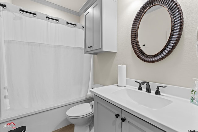 bathroom featuring crown molding, vanity, and toilet