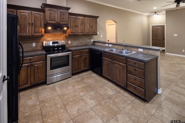 kitchen featuring dark countertops, a peninsula, under cabinet range hood, black appliances, and a sink