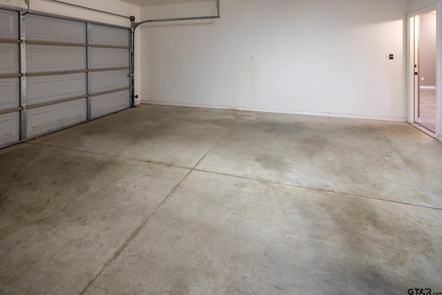 garage featuring baseboards