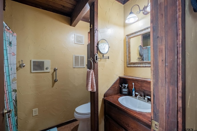 bathroom with visible vents, toilet, and vanity