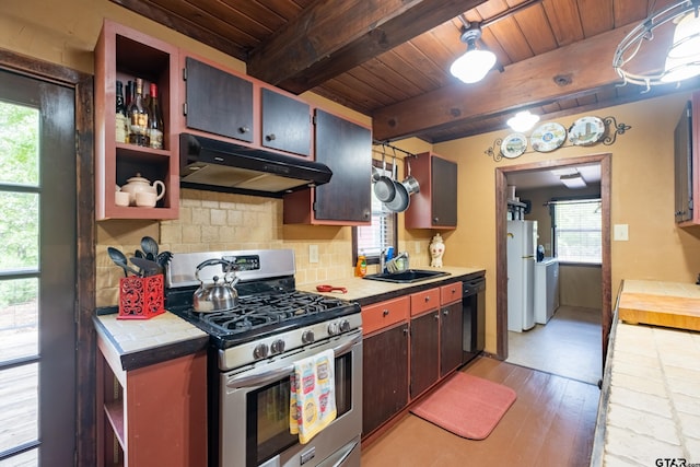 kitchen featuring wood ceiling, a sink, freestanding refrigerator, gas range, and under cabinet range hood
