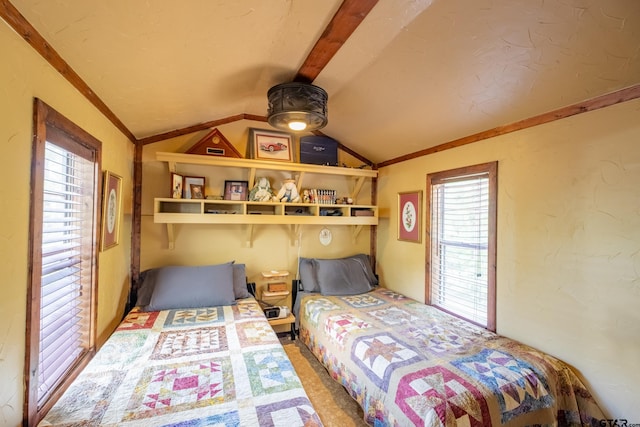 bedroom featuring vaulted ceiling and carpet floors