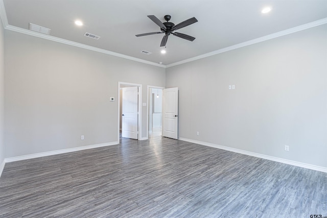 spare room with ceiling fan, ornamental molding, and dark hardwood / wood-style floors