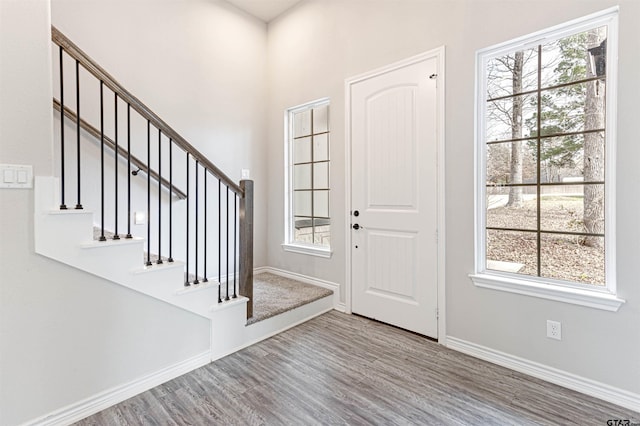 foyer entrance with hardwood / wood-style floors and plenty of natural light