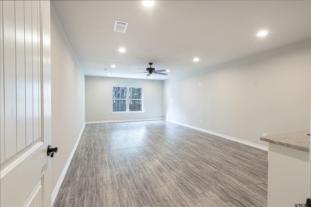 spare room featuring ceiling fan and hardwood / wood-style flooring