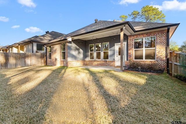 ranch-style house featuring a patio area and a front lawn