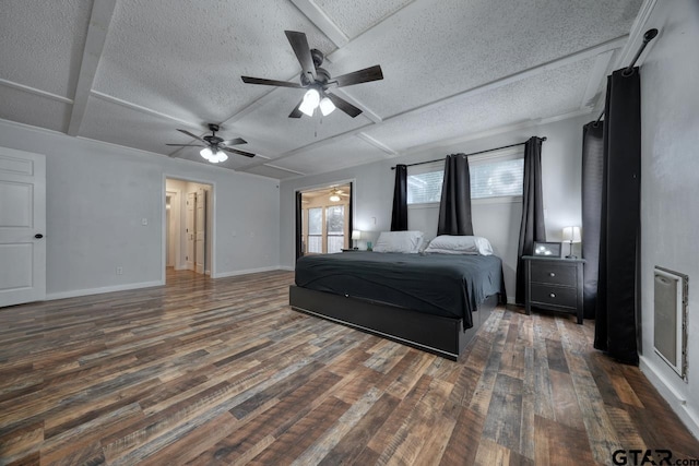 bedroom featuring a textured ceiling, dark hardwood / wood-style flooring, and ceiling fan