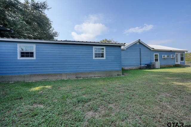 view of property exterior featuring a lawn