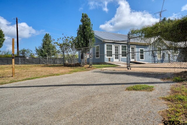 birds eye view of property featuring a water view and a rural view